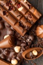 Chocolate with raisins and nuts on a dark wooden background close-up Royalty Free Stock Photo