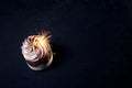 Chocolate and Raspberry Birthday Cake with Sparkler on Dark Background