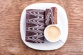 Chocolate roll with a cup of coffee Royalty Free Stock Photo