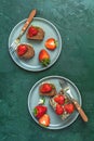 Chocolate rollcake with fresh strawberries in ceramic plate