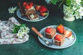 Chocolate rollcake with fresh strawberries in ceramic plate