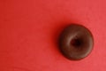 Chocolate round biscuit on a red background