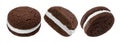 Chocolate sandwich cookies, baked biscuits stuffed with milk cream isolated on white background Royalty Free Stock Photo