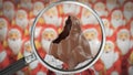 Chocolate Santa Claus is being inspected Royalty Free Stock Photo