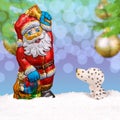 Chocolate Santa Claus in the snow Royalty Free Stock Photo