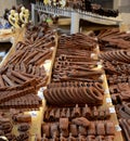 Chocolate sculpture carvings of guns pipes cars chains