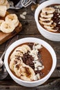 Chocolate smoothie bowl with banana, chia seeds and almond chips Royalty Free Stock Photo