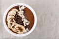 Chocolate smoothie bowl with banana, chia seeds and almond chips Royalty Free Stock Photo