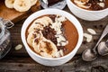 Chocolate smoothie bowl with banana, chia seeds and almond chips Royalty Free Stock Photo