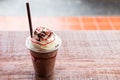 Chocolate smootie frappuccino on wooden table