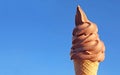 Chocolate Soft Serve Ice Cream Cone Against Blue Sky Royalty Free Stock Photo