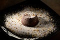 Chocolate souffle home, baked in oven from hight quality cocoa and decorated on a plate ready to be served in restaurant