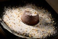 Chocolate souffle home, baked in oven from hight quality cocoa and decorated on a plate ready to be served in restaurant