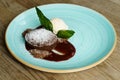 Chocolate souffle with strawberry sauce and vanilla ice cream Royalty Free Stock Photo