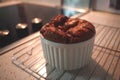 A Chocolate Souffle in a White Ramekin