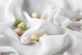 Chocolate specled Easter eggs in gauze fabric folds Royalty Free Stock Photo