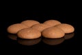 Chocolate sponge biscuit isolated on black glass