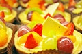 Close up of fresh and tasty cakes with fruits and berries Royalty Free Stock Photo