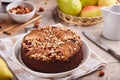 Chocolate sponge cake with pears and hazelnuts. Royalty Free Stock Photo