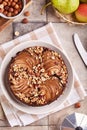 Chocolate sponge cake with pears and hazelnuts. Top view. Royalty Free Stock Photo