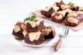 Chocolate spongy brownie cakes with cookies - Brookies in a white plate. Trend dessert