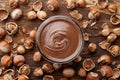 Chocolate spread with hazelnuts on wooden background Royalty Free Stock Photo