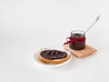 Chocolate spread on rustic bread with jar and spoon on white background Royalty Free Stock Photo