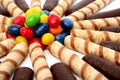 Chocolate sticks with a cream and the multi-coloured sweets Royalty Free Stock Photo