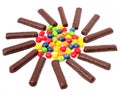 Chocolate sticks with a cream and the multi-coloured sweets isol Royalty Free Stock Photo
