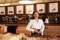 Chocolate Store. Female Seller In Confectionery Shop. Royalty Free Stock Photo