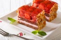 Chocolate strawberry cake with almonds close-up on a plate. horizontal Royalty Free Stock Photo