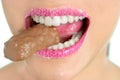 Chocolate sweet in beautiful woman mouth Royalty Free Stock Photo