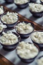 Chocolate sweet dessert filling with coconut cream and coconut petals on top, product photography fot patisserie Royalty Free Stock Photo