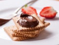 Chocolate sweet melting nougat cream on cookies with strawberries Royalty Free Stock Photo