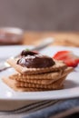 Chocolate sweet melting nougat cream on cookies with strawberries Royalty Free Stock Photo