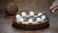 Cutting chocolate coconut cake