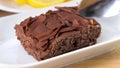 Chocolate tasty cake with spoon on table, close-up