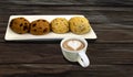 Chocolate toasted mochi bun  with cup of coffee on vintage wooden table Royalty Free Stock Photo