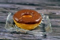 chocolate topping on a fried sweet donut, a doughnut or donut, a type of food made from leavened fried dough, usually deep fried