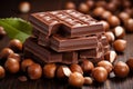 Chocolate tower with hazelnut and leaves on white background. Stack of milk and dark chocolate with nuts. Generative AI