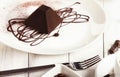 Chocolate truffle cake in pyramid shape Royalty Free Stock Photo