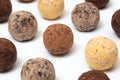 Chocolate truffle candies on a white background, close-up Royalty Free Stock Photo