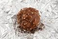 Chocolate truffle on silver wrapper