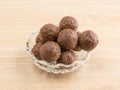 Chocolate truffles in a bowl on a table Royalty Free Stock Photo