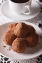 Chocolate truffles close-up and coffee on the table. vertical Royalty Free Stock Photo