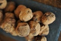 Chocolate truffles in cocoa sprinkled. On the slate board on wooden background. Close-up, texture Royalty Free Stock Photo