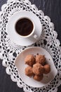 Chocolate truffles and coffee close-up on the table. vertical to Royalty Free Stock Photo