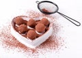 Chocolate truffles served on the heart shaped plate Royalty Free Stock Photo