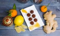 Chocolate truffles with ginger candies in a gift box Royalty Free Stock Photo