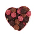 Chocolate truffles in heart shaped box Royalty Free Stock Photo